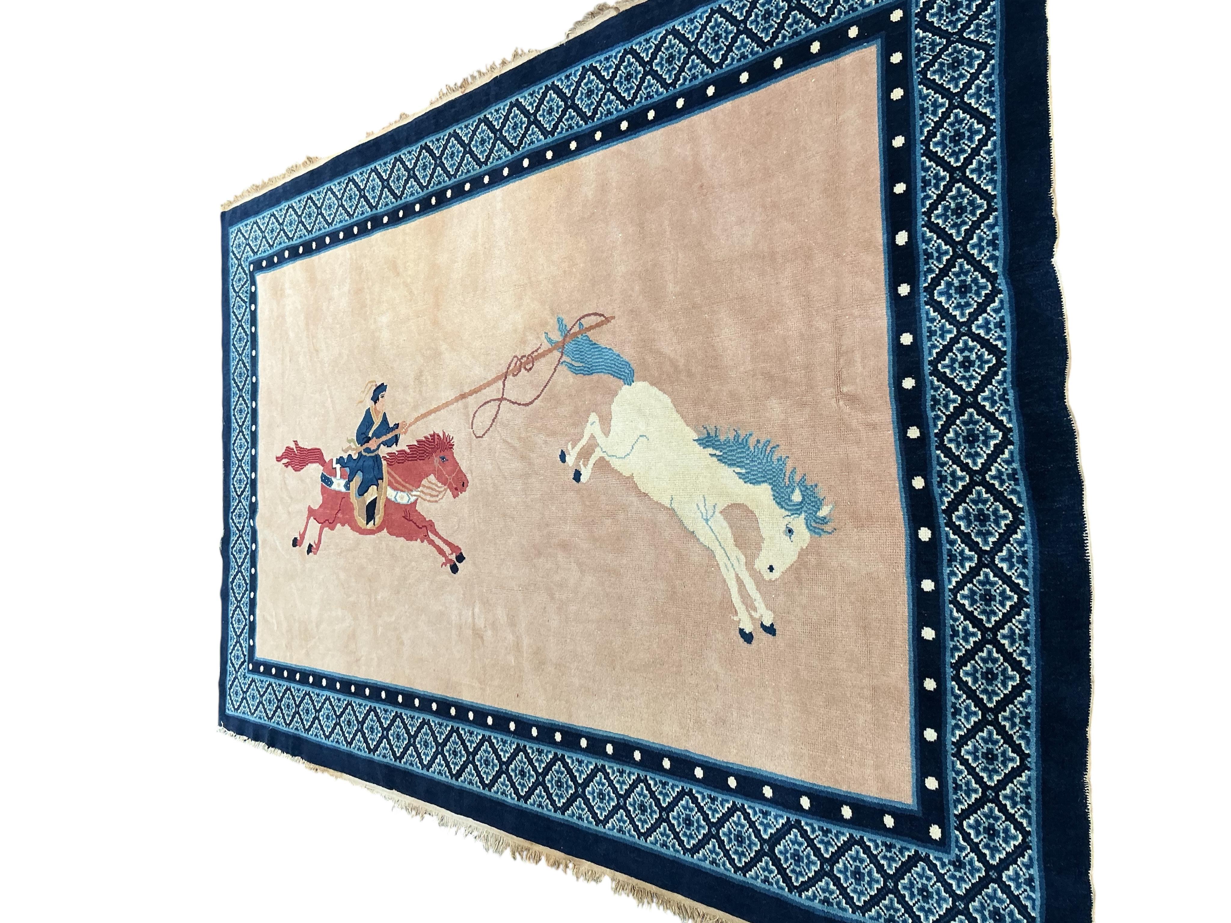 An early 20th century Chinese fawn ground rug, retailed by Liberty and Co, 248 x 154cm.